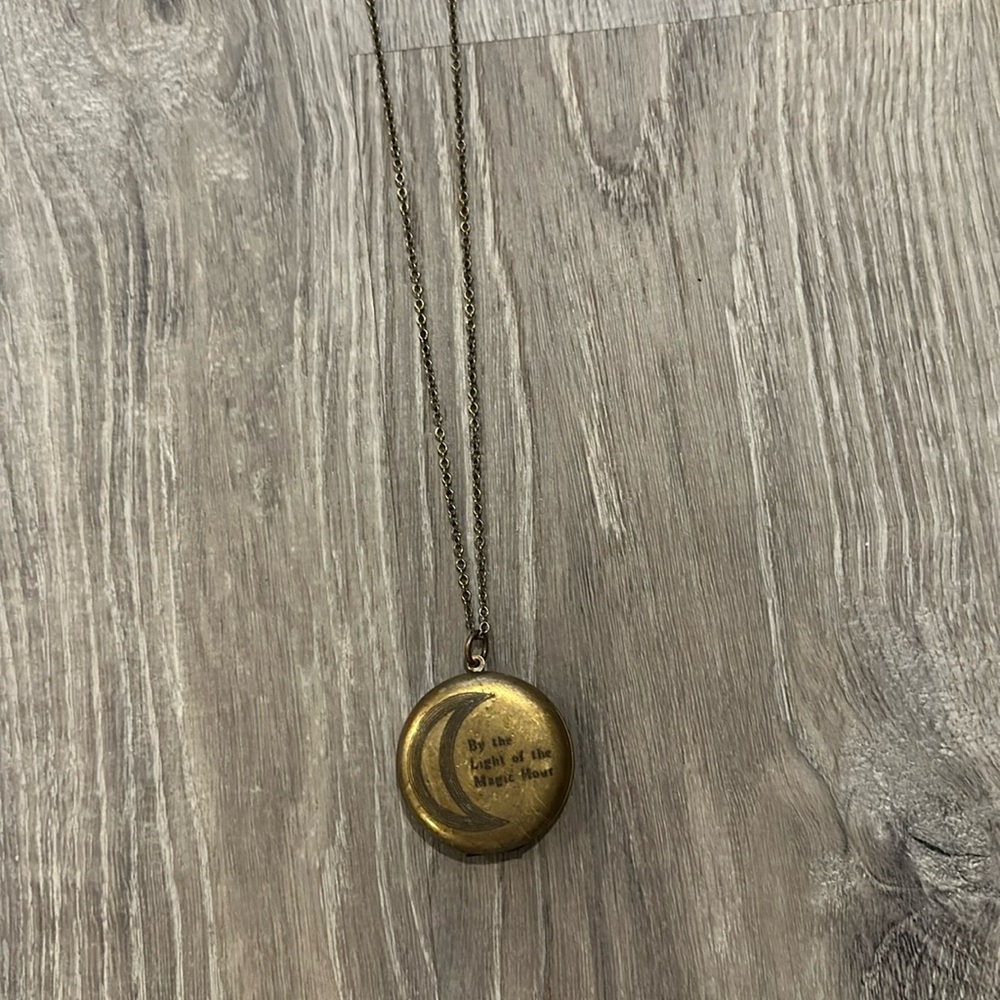 Free people locket necklace “by the light of the magic hour”